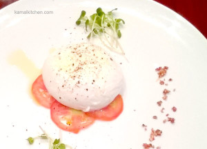Prego at Westin, Pune has a new chef. Italian Chef Eraldo Colazzo has worked in 18 countries for over 38 years, and has dished out his creations to such luminaries as President Clinton, Nelson Mandela and Princess Diana. So when an invite for an exclusive preview of Chef Eraldo’s new menu landed in my Inbox, I was ready to head out. Restaurant food or popular food of any cuisine is so limited and it is not always a true indicator of the kind of food people eat every day. I have been stressing this point in my books. Just as Indian food is so much more than spicy oil laden curries, the true taste of Italy goes much beyond pizzas and saucy pastas. Fresh produce and good quality ingredients have always been a hallmark of the food at Prego, or at any restaurant at Westin Pune, really. Now we have a well traveled and experienced chef who cooks from the heart, and lets the simple, honest food do the talking. The long drive in 40C heat was forgotten as I was greeted effusively by Arpit, the restaurant manager. An ice cold grappa was offered and savored, followed by an exotic elder flower based mocktail. I am not sure if it is on the menu, but it is something worth trying. The guests gradually assembled and about an hour later, we finally got to meet Chef Colazzo himself. The mark of a great man (or woman) is how humble and modest they are, and this was evident in the few words the chef said. The wine was poured, a crisp, dry Pinot Grigio in my case, and fresh bread was served. Both the herbed foccacia and a dark boule passed muster. It was served with a tangy tomato basil sauce. I would have preferred some butter and good olive oil with this bread though, with or without the sauce. Chef Eraldo believes in using what is in season. After an amuse bouche of zucchini tempura, we were served a salad of fresh watermelon, mango and feta cheese with a honey lemon dressing. The salad was very lightly seasoned and dressed, but it disappeared in seconds. Another salad we tried was Insalata Itaca, with lettuce, feta cheese, olives, peppers and sun dried tomatoes. Insalata Burrata was the highlight of the evening for me. Burrata is a super creamy cheese, reminiscent of ricotta and mozzarella. The cheese was a lot creamier than ricotta and very smooth, unlike ricotta which is somewhat grainy. Served with a slight sprinkling of black pepper and a slice of tomato, the burrata is pure bliss for cheese lovers. The Penne Norma had bold flavors of aubergine or eggplant with a scant sauce. Finely chopped mozzarella was sprinkled through the pasta which was perfectly al dente. Risottos are quite popular in India, and beetroot is the latest wonder vegetable. Combining the two has to be a winning combination. The beetroot risotto had the earthiness of beet and an oniony, chive like flavor through it. A parmesan sauce was poured on top, a slight variation from the grated cheese we expect. The mixed berry Panna Cotta with sambuca was a fitting finale to the meal. The Panna Cotta was set a bit softer which did not matter since it was served in a martini glass. It was certainly gobble worthy. Chef Anurudh Khanna, the Executive Chef at Westin Pune promises seasonal menus and daily specials based on what is fresh at their farms. Take a bite of the luscious burrata, close your eyes, and you could almost, almost imagine yourself in a Tuscan hill town. Chef Eraldo Colazzo and his new menu launches on May 5, 2016. So bookmark this and head to Prego for fresh, authentic Italian fare. Read more about Chef Eraldo’s creations at MovieRecipe, our partner blog.